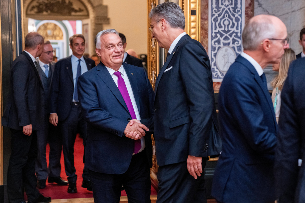Hungary's Prime Minister, Viktor Orban, left, and Croatia's Prime Minister, Andrej Plenkovicthe shake hands at the Danish parliament at Christiansborg Castle in Copenhagen as Denmark is hosting an informal summit for the EUs heads of state and government, Wednesday, Oct. 1, 2025 . (Ida Marie Odgaard/Ritzau Scanpix via AP)