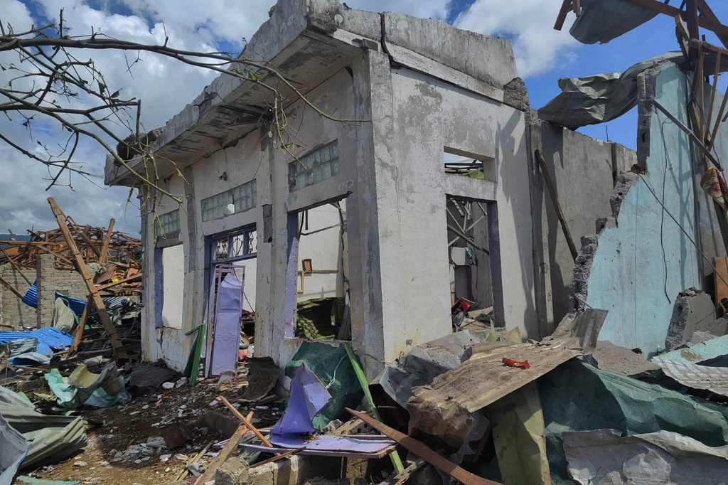 This handout photo provided by Palaung Land shows debris of the buildings destroyed in an explosion in Kaungtup village, Namhkam township, Shan State, Myanmar, on Sunday, May 31, 2026. (Palaung Land via AP)