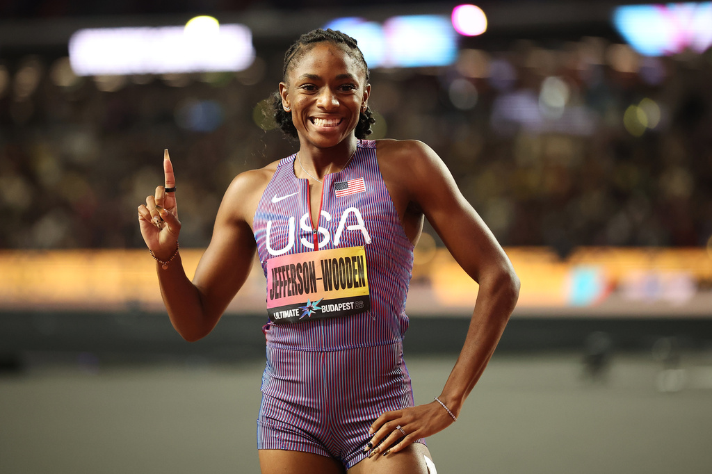 Melissa Jefferson-Wooden, of the United States, celebrates after winning the women's 100 meters final and posting a world-leading time during the World Athletics Ultimate Championship in Budapest, Hungary, Saturday, Sept. 12, 2026. (AP Photo/Armin Durgut)