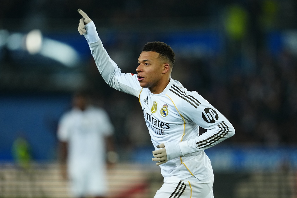 Real Madrid's Kylian Mbappe celebrates after scoring the opening goal during the Spanish La Liga soccer match between Alaves and Real Madrid in Vitoria-Gasteiz, Spain, Sunday, Dec. 14, 2025. (AP Photo/Miguel Oses)
