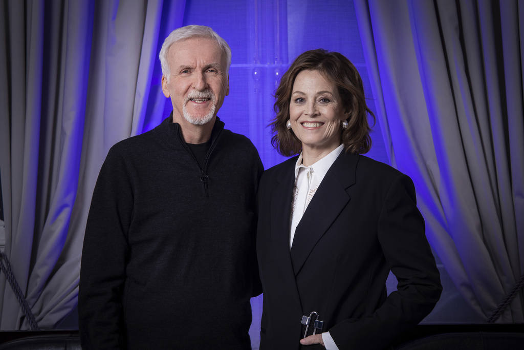 FILE - Director James Cameron, left, and Sigourney Weaver pose for a photo to promote the film "Avatar: The Way of Water" in London, on Dec. 4, 2022. (Photo by Vianney Le Caer/Invision/AP, File)