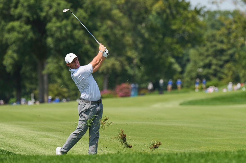Rory McIlroy, of Northern Ireland, hits from the rough on the fourth hole during the third round of the BMW Championship golf tournament Saturday, Aug. 22, 2026, in St. Louis. (AP Photo/Jeff Roberson)