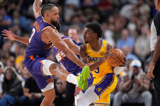 Los Angeles Lakers guard Bronny James, right, tries to pass while under pressure from Phoenix Suns forward Dillon Brooks during the second half of an NBA preseason basketball game Friday, Oct. 3, 2025, in Palm Desert, Calif. (AP Photo/Mark J. Terrill) Los Angeles Lakers guard Bronny James, right, tries to pass while under pressure from Phoenix Suns forward Dillon Brooks during the second half of an NBA preseason basketball game Friday, Oct. 3, 2025, in Palm Desert, Calif. (AP Photo/Mark J. Terrill)
