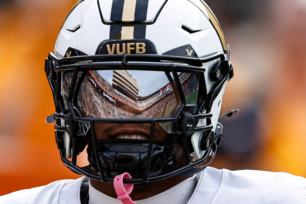 Neyland Stadium is reflected in the mask of Vanderbilt cornerback Marlon Jones Jr. (0) before an NCAA college football game against Tennessee, Saturday, Nov. 29, 2025, in Knoxville, Tenn. (AP Photo/Wade Payne)
