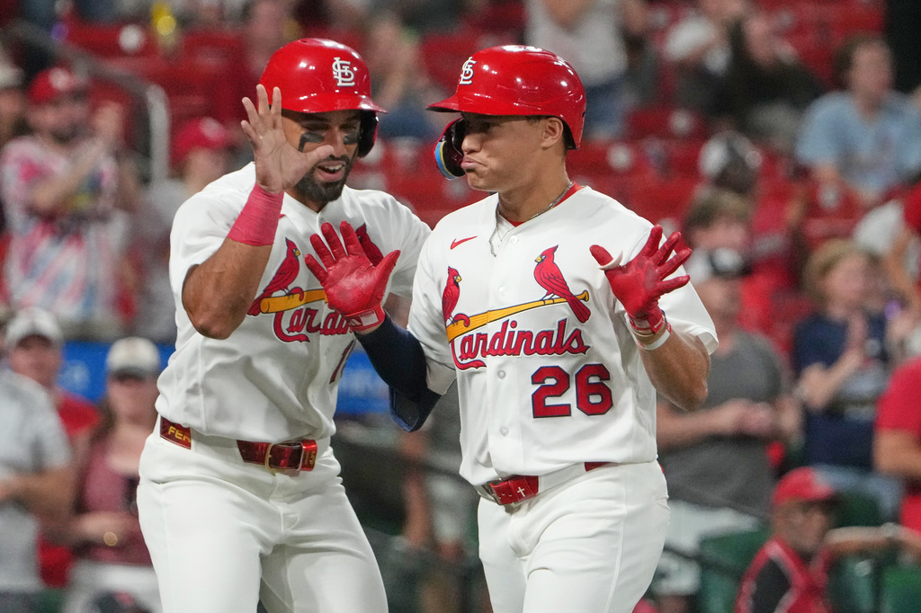 St. Louis Cardinals' JJ Wetherholt (26) is congratulated by teammate José Fermín after hitting a two-run home run during the eighth inning of a baseball game against the Cleveland Guardians Tuesday, April 14, 2026, in St. Louis. (AP Photo/Jeff Roberson)