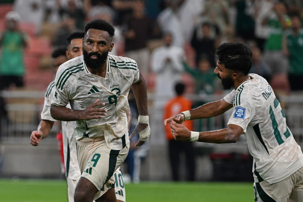 Saudi Arabia's Feras Albrikan, left, celebrates after scoring his side's opening goal during the World Cup 2026 Asian qualifier fourth-round Group B soccer match between Saudi Arabia and Indonesia at Alinma Bank Stadium in King Abdullah Sports City, in Jiddah, Saudi Arabia, Wednesday, Oct. 8, 2025. (AP Photo)