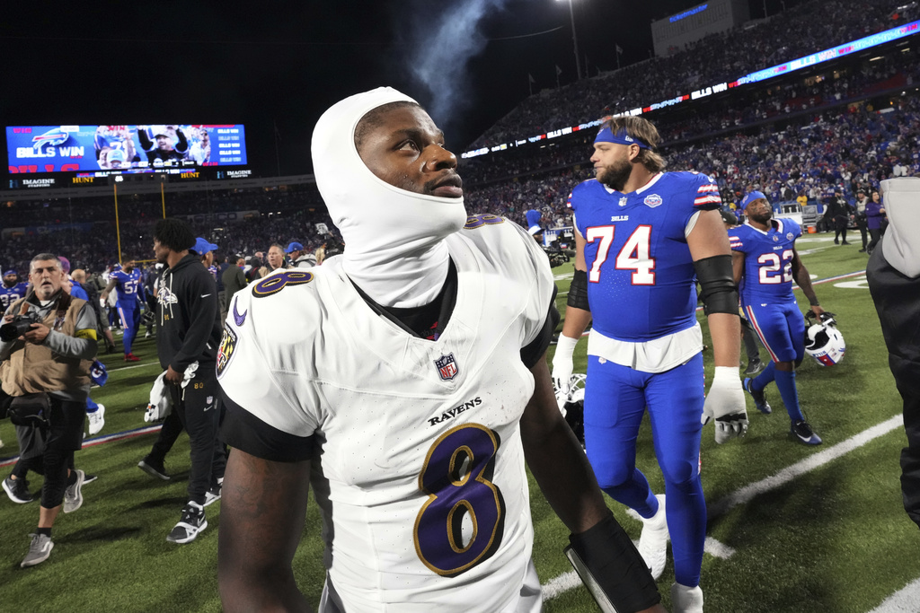 Baltimore Ravens quarterback Lamar Jackson (8) walks off the field after the team's loss to the Buffalo Bills in an NFL football game in Orchard Park, N.Y., Sunday, Sept. 7, 2025. (AP Photo/Gene J. Puskar)
