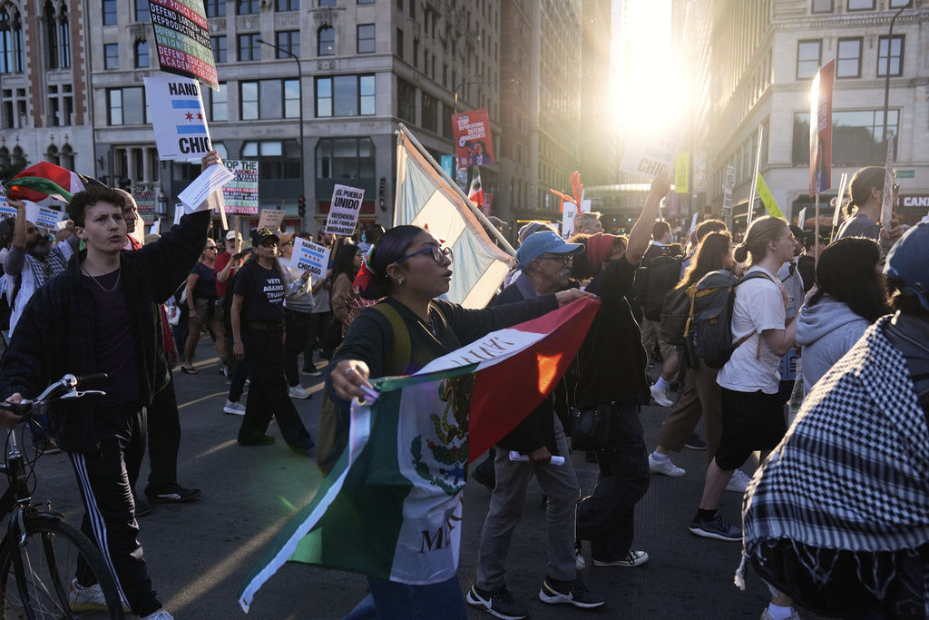Demonstrators march at a protest opposing "Operation Midway Blitz" and the presence of ICE, Tuesday, Sept. 9, 2025, in Chicago. (AP Photo/Erin Hooley)