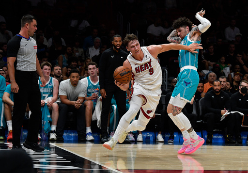 Miami Heat guard Pelle Larsson (9) dribbles past Charlotte Hornets guard Lamelo Ball during the first half of an NBA basketball game, Tuesday, Oct. 28, 2025, in Miami. (AP Photo/Michael Laughlin) Miami Heat guard Pelle Larsson (9) dribbles past Charlotte Hornets guard Lamelo Ball during the first half of an NBA basketball game, Tuesday, Oct. 28, 2025, in Miami. (AP Photo/Michael Laughlin)