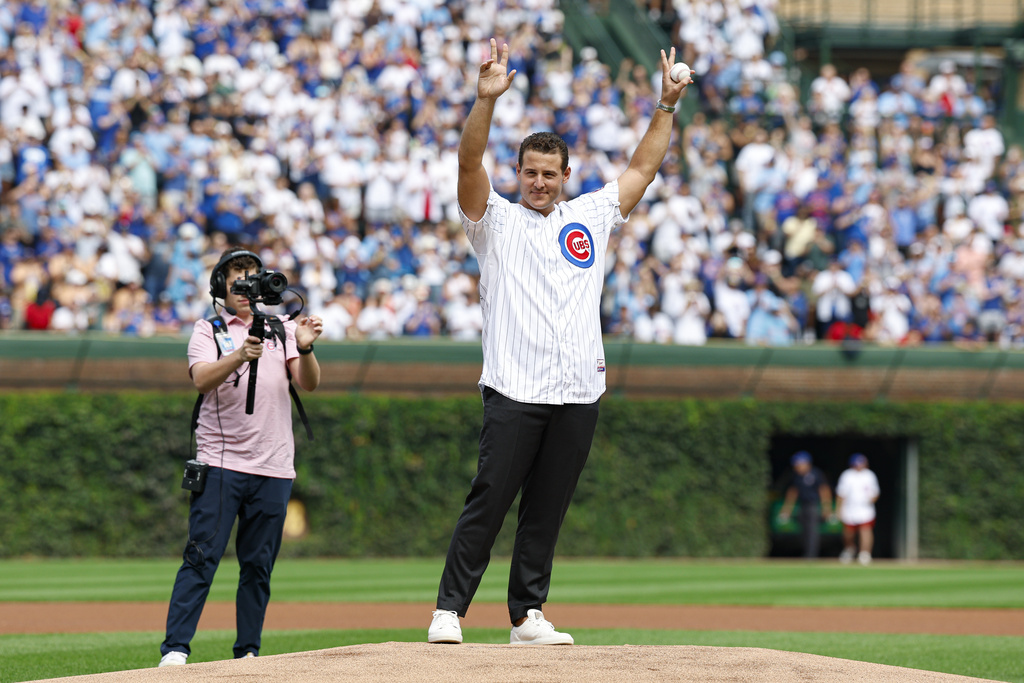 Former Chicago Cubs player Anthony Rizzo waves before throwing out a ceremonial first pitch before a baseball game between the Chicago Cubs and Tampa Bay Rays, Saturday, Sept. 13, 2025, in Chicago. (AP Photo/Kamil Krzaczynski)