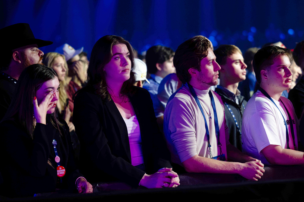 Attendees listen during Turning Point USA's AmericaFest 2025, Thursday, Dec. 18, 2025, in Phoenix. (AP Photo/Jon Cherry)