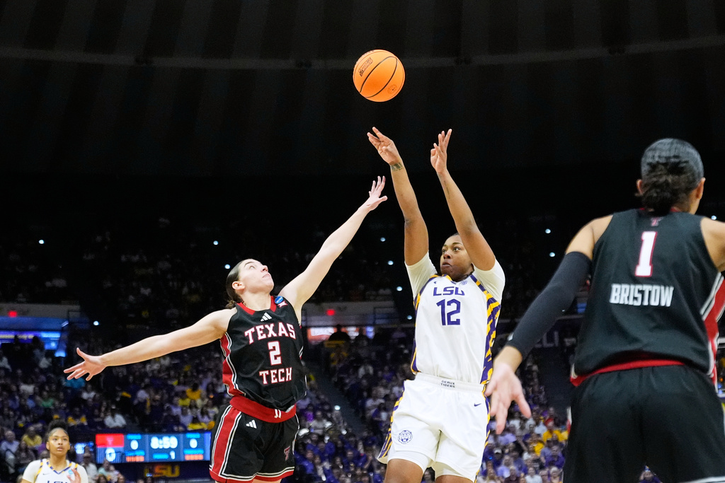 LSU guard Mikaylah Williams (12) shoots against Texas Tech guard Gemma Nunez (2) during the first half in the second round of the NCAA college basketball tournament, Sunday, March 22, 2026, in Baton Rouge, La. (AP Photo/Gerald Herbert)