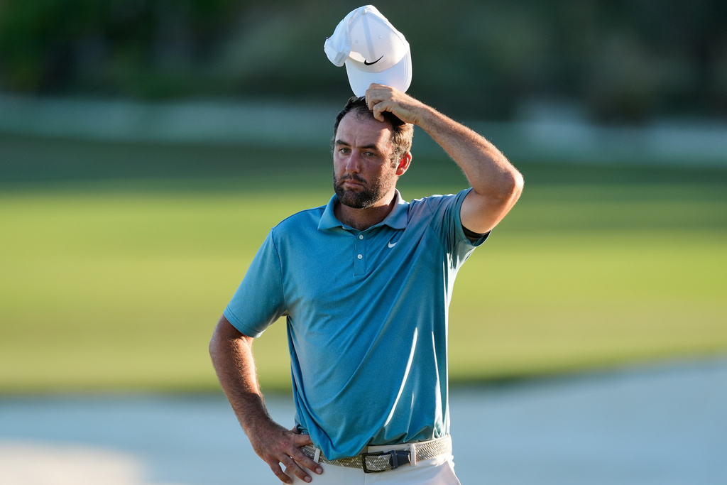 Scottie Scheffler, of the United States, reacts after the third round of the Hero World Challenge PGA Tour at the Albany Golf Club, in New Providence, Bahamas, Saturday, Dec. 6, 2025. (AP Photo/Fernando Llano)