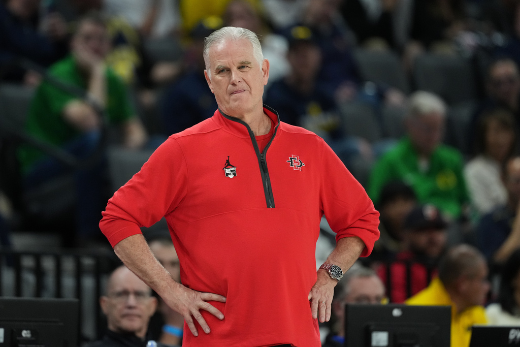 San Diego State head coach Brian Dutcher watches from the side lines during the second half of an NCAA college basketball game against Michigan in Las Vegas, Monday, Nov. 24, 2025. (AP Photo/Eric Gay)