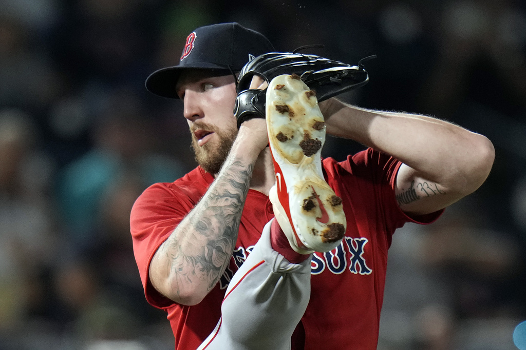 Boston Red Sox's Garrett Crochet kicks before throwing a pitch to the Tampa Bay Rays during the first inning of a baseball game Friday, Sept. 19, 2025, in Tampa, Fla. (AP Photo/Chris O'Meara)