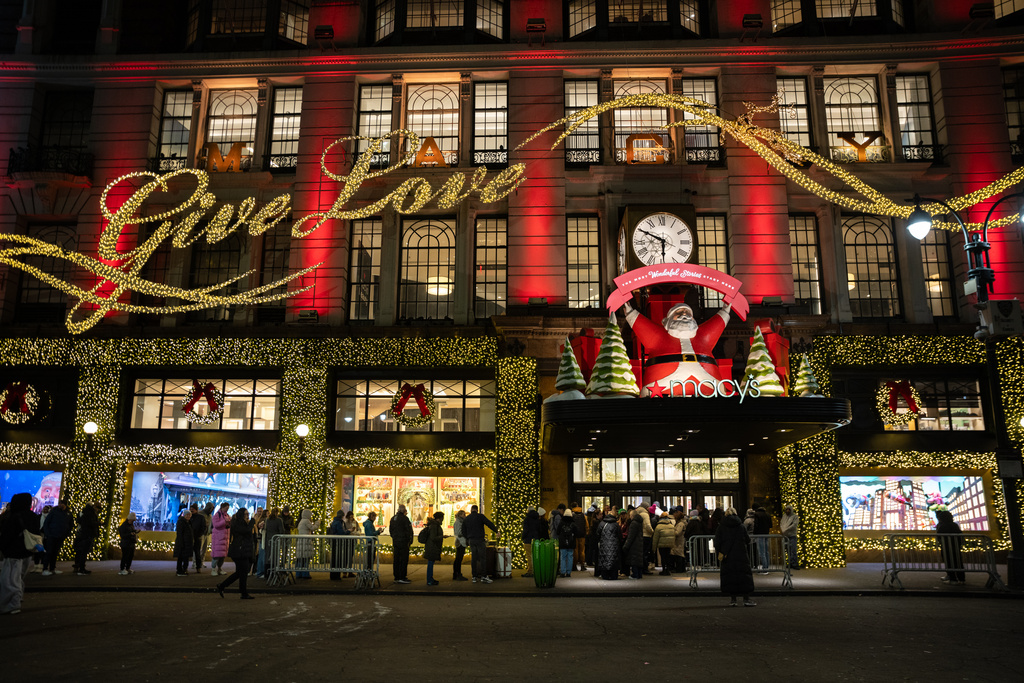 Black Friday Shoppers wait in line to enter Macy's flagship store on Friday, Nov. 28, 2025 in New York. (AP Photo/Angelina Katsanis)