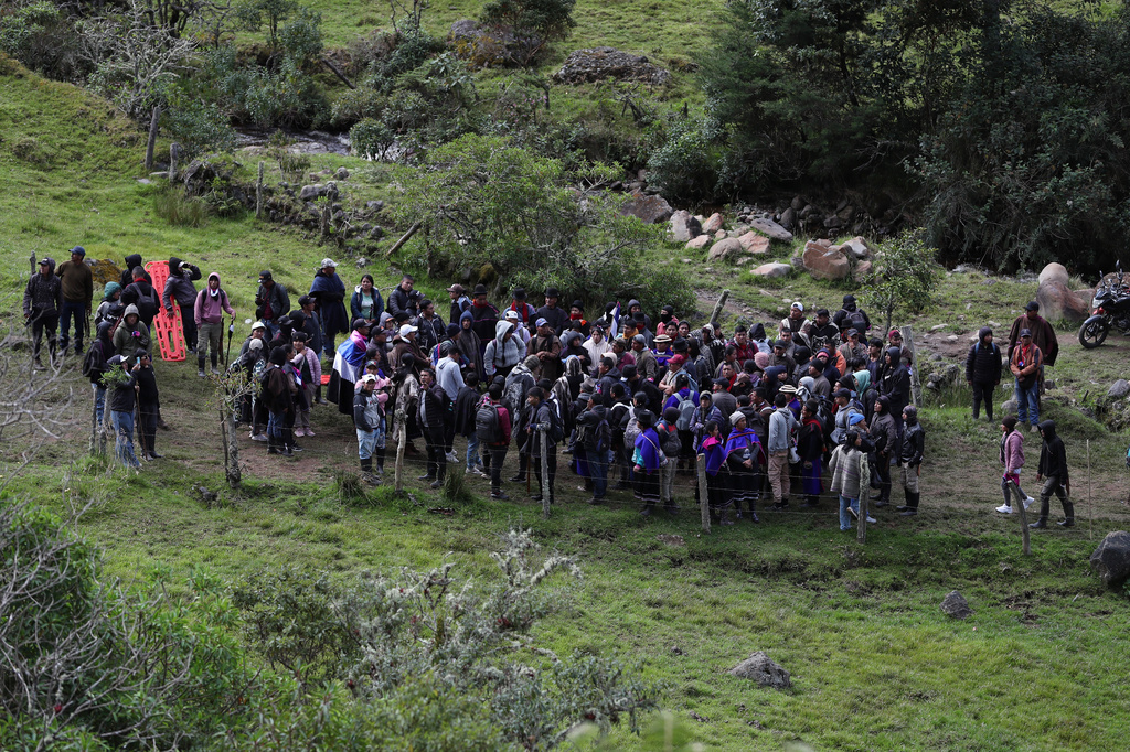 Misak Indigenous patrol after deadly clashes with the Nasa community over a land dispute in Silvia, Colombia, Friday, May 22, 2026.(AP Photo/Santiago Saldarriaga)