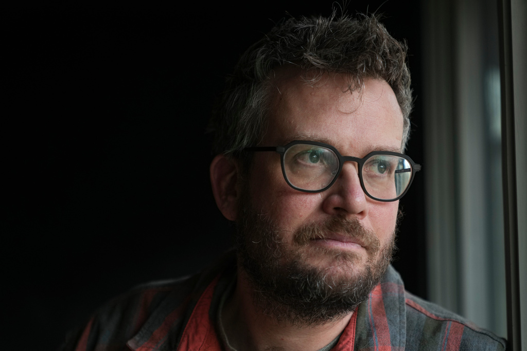 Writer John Green poses in his studio in Indianapolis, Wednesday, Jan. 21, 2026. (AP Photo/Michael Conroy)