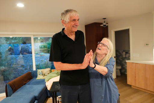 John Martinis stands with his wife Jean in their living room after winning the Nobel Prize in Physics for his work on quantum tunneling on Tuesday, Oct. 7, 2025, in Santa Barbara, Calif. (AP Photo/Mark J. Terrill) John Martinis stands with his wife Jean in their living room after winning the Nobel Prize in Physics for his work on quantum tunneling on Tuesday, Oct. 7, 2025, in Santa Barbara, Calif. (AP Photo/Mark J. Terrill)