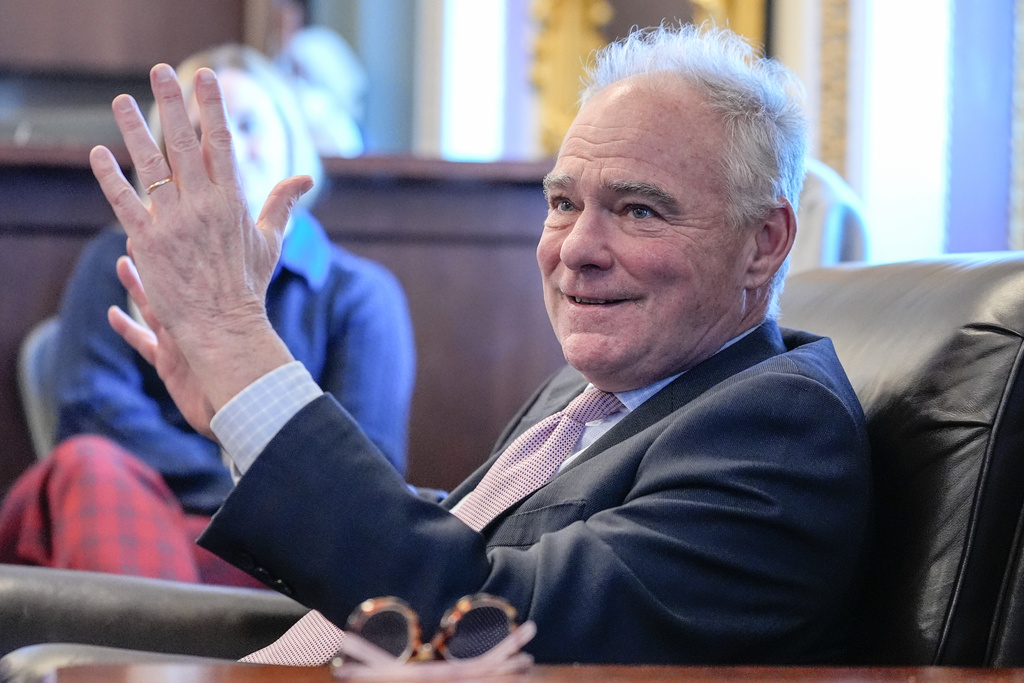 Sen. Tim Kaine, D-Va., speaks to reporters about a war powers resolution regarding Venezuela on Capitol Hill, Wednesday, Jan. 7, 2026, in Washington. (AP Photo/Mariam Zuhaib)