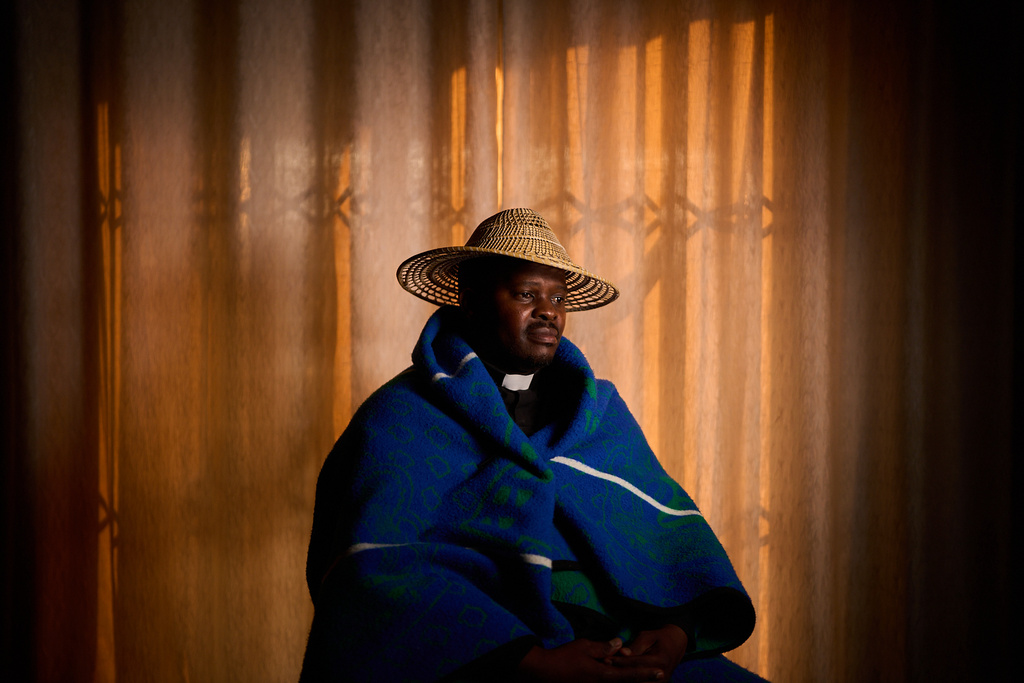 The Rev. Khethang Manyarela poses for a portrait inside his home in Maseru, Lesotho, Sunday, July 20, 2025. Many of his churchgoers are HIV-positive and struggling, particularly after U.S. aid cuts. (AP Photo/Bram Janssen)