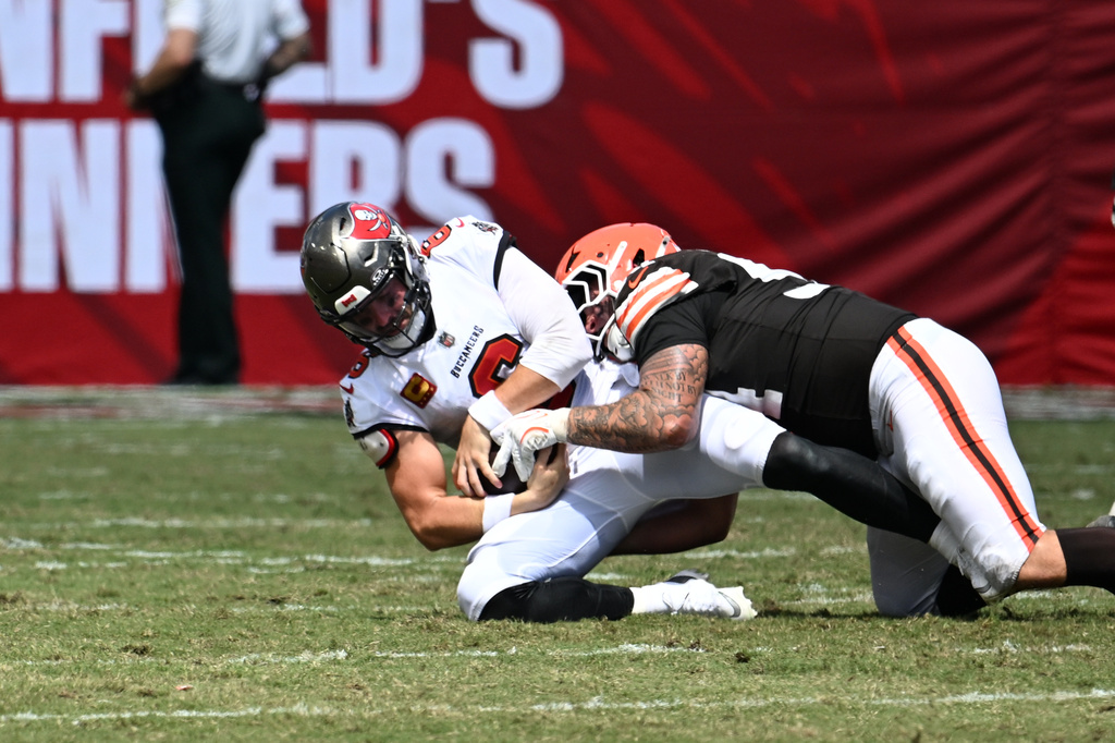 Cleveland Browns defensive tackle Mason Graham (94) sacks Tampa Bay Buccaneers quarterback Baker Mayfield (6) during the first half of an NFL football game in Tampa, Fla., Sunday, Sept. 20, 2026. (AP Photo/Jason Behnken)