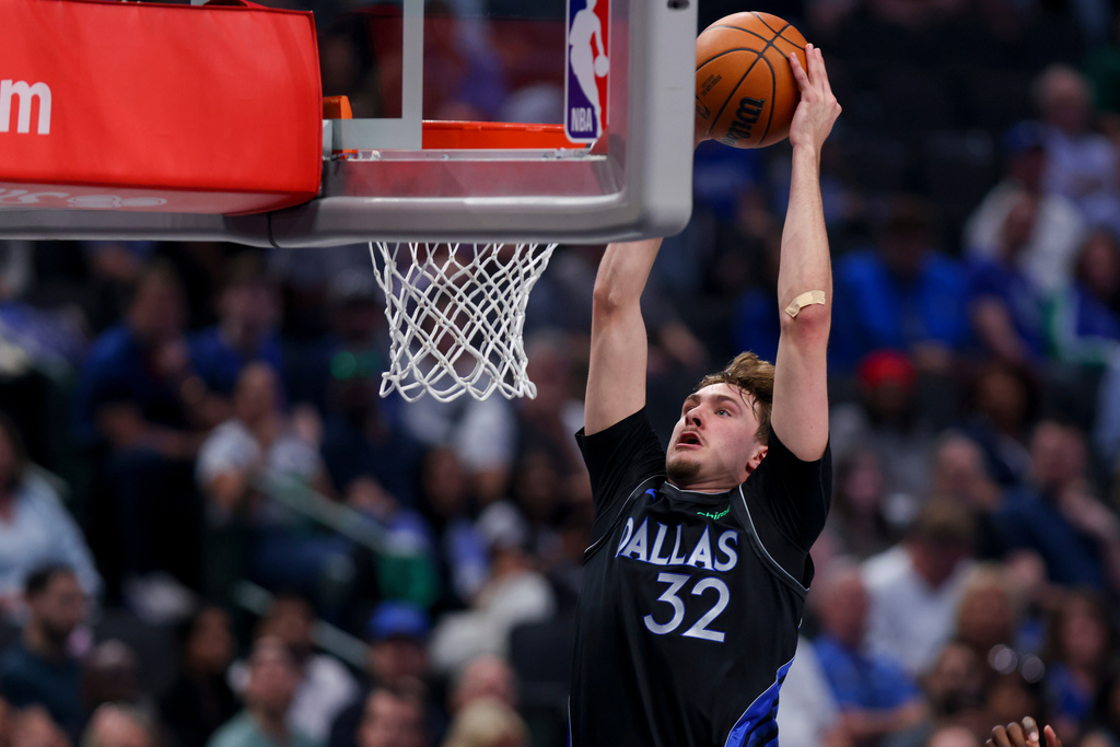 Dallas Mavericks forward Cooper Flagg dunks in the first half of an NBA basketball game against the Minnesota Timberwolves Monday, March 30, 2026, in Dallas. (AP Photo/Gareth Patterson)