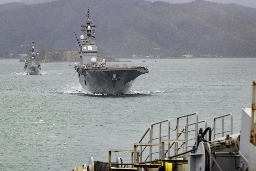 Two ships from the Japan Maritime Self-Defense Force, JS Ise and destroyer JS Suzunami sail into Wellington, New Zealand to begin a three-day ceremonial port visit, Friday, Aug. 8, 2025. (Monique Ford/Stuff via AP)