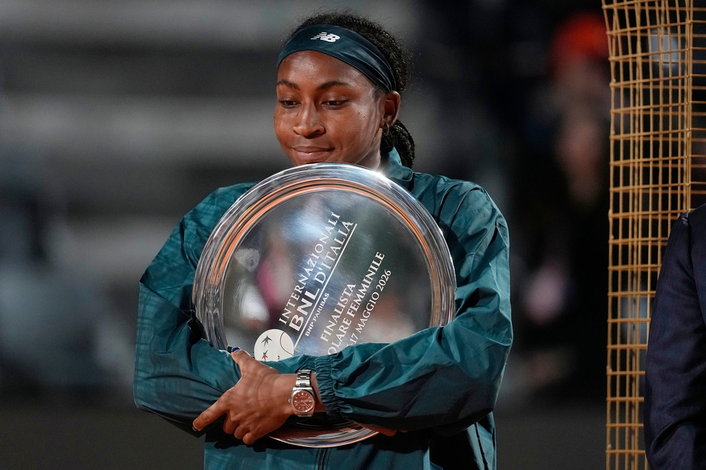 United States' Coco Gauff holds a trophy after playing against Ukraine's Elina Svitolina in the women's final match at the Italian Open tennis tournament in Rome, Saturday, May 16, 2026. (AP Photo/Alessandra Tarantino)