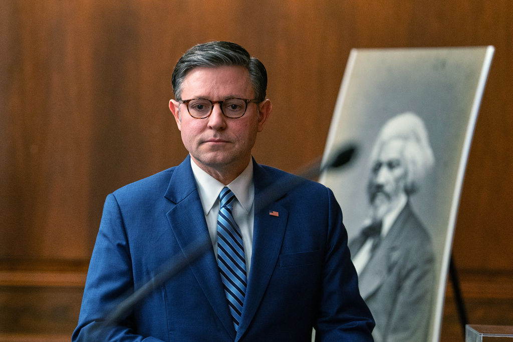 Speaker Mike Johnson, R-La., arrives to the Frederick Douglass Press Gallery dedication at the Capitol, Thursday, Feb. 12, 2026, in Washington. (AP Photo/Allison Robbert)