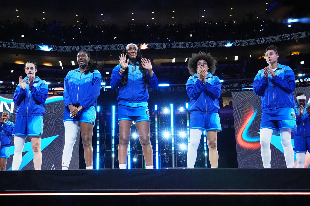 Left to right; Team Spoon's Caitlin Clark, Aliyah Boston, A'Ja Wilson, Olivia Miles and Jessica Shepard greet fans before a WNBA All-Star basketball game against Team Coop in Chicago, Saturday, July 25, 2026. (AP Photo/Nam Y. Huh)