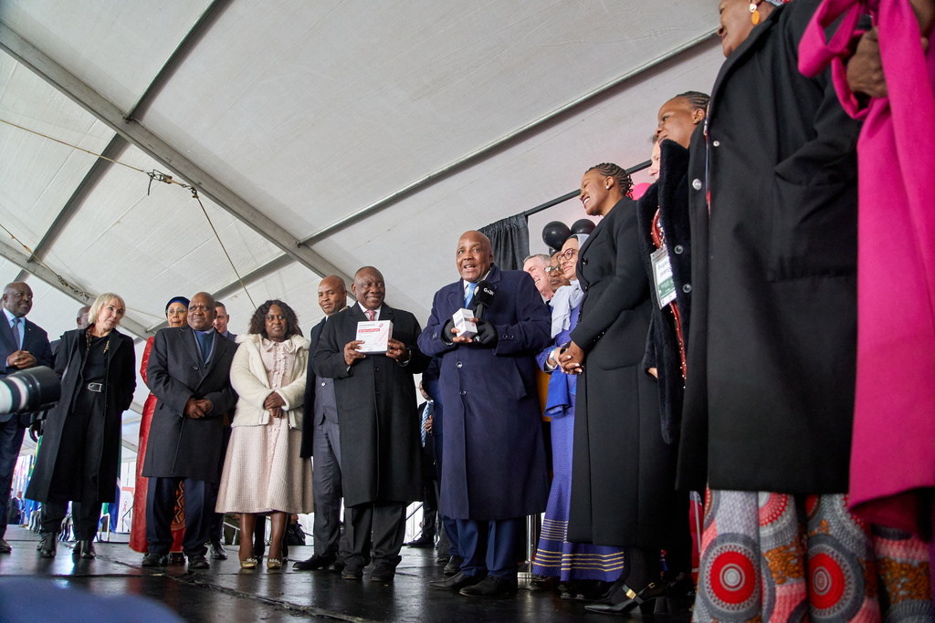 South African President, Cyril Ramaphosa and Health Minister, Aaron Motsoaledi, among other delegates, hold a box of Lenacapavir during the official launch of the drug's rollout programme in Secunda, South Africa, Friday, June 5, 2026. (AP Photo/Kayleen Morgan)