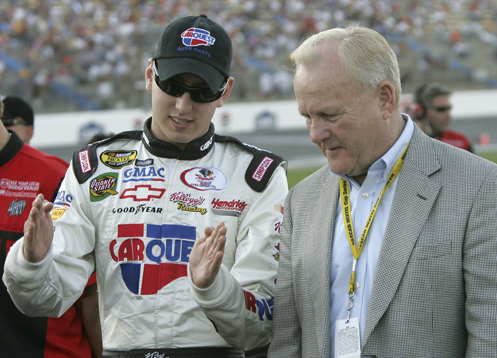 FILE - Kyle Busch, left, and H.A. "Humpy" Wheeler, President of Lowe's Motor Speedway, chat prior to qualifying in Concord, N.C., May 26, 2005. (AP Photo/Gerry Broome, file)