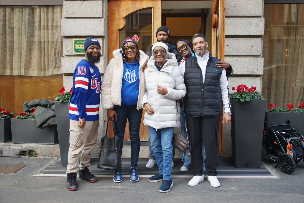 Laila Edwards’ family pose for a photo in front of their hotel from left, Terrell Duckworth, cousin; Vanessa Duckworth, aunt; Ernestine Gray, grandmother; Charone Gray-Edwards, mother; Robert Edwards, father; background, Bobby Edwards, 27, Laila’s brother, at the 2026 Winter Olympics, in Milan, Italy, Monday, Feb. 16, 2026. (AP Photo/Annie Risemberg)