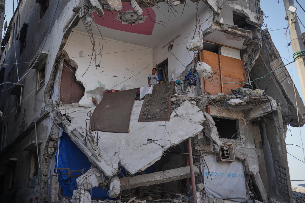 Displaced Palestinians shelter inside a building heavily damaged during the Israel-Hamas war in Gaza City, Thursday, Sept. 17, 2026. (AP Photo/Jehad Alshrafi)