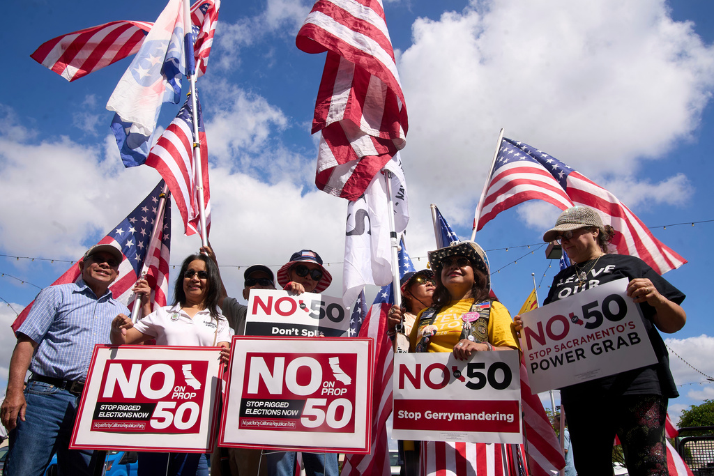 FILE - Opponents of California Proposition 50, also known as the Election Rigging Response Act, a California ballot measure that would redraw congressional maps to benefit Democrats, rally in Westminster, Calif., on Wednesday, Sept. 10, 2025. (AP Photo/Damian Dovarganes, File)