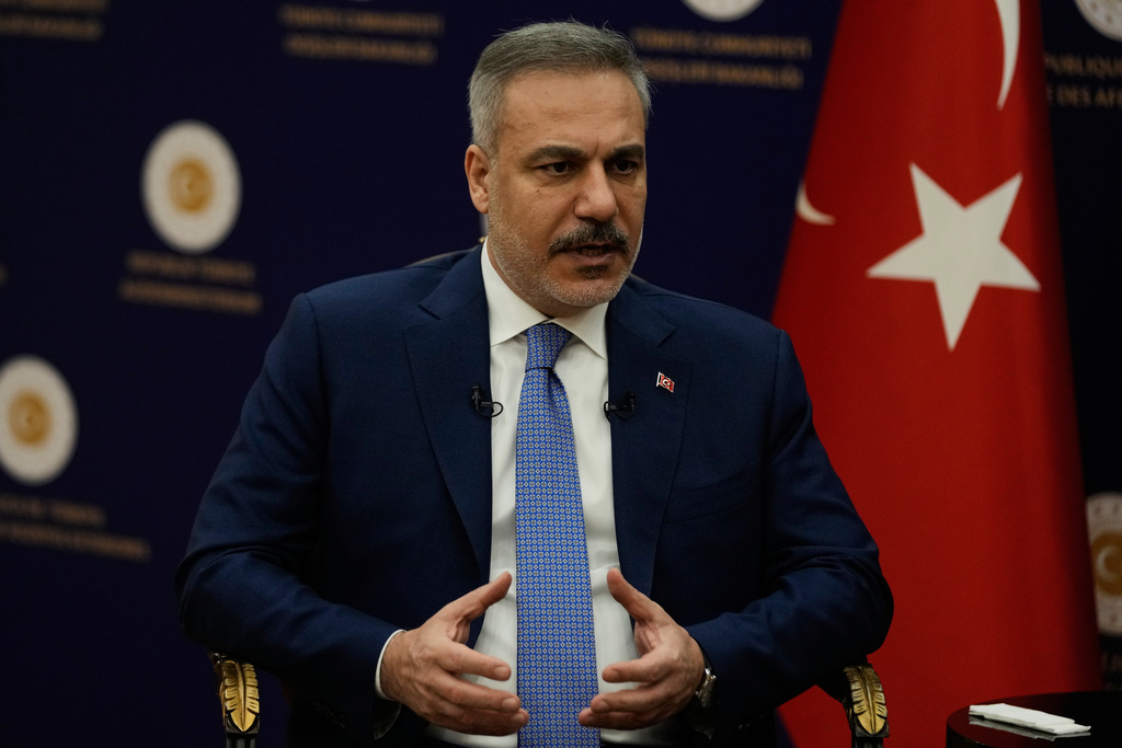 Turkey's Foreign Minister Hakan Fidan speaks during an interview with The Associated Press, in Ankara, Turkey, Saturday, March 14, 2026. (AP Photo/Khalil Hamra)