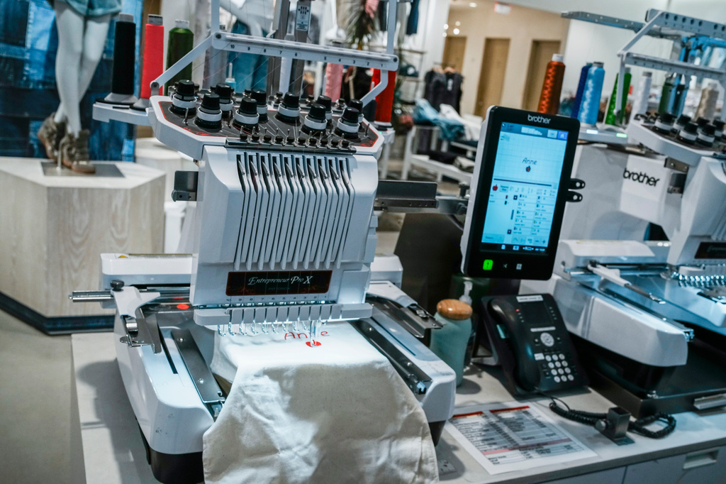 An embroidery machine works on a decoration at Nordstrom Manhattan flagship in New York, Monday, March 23, 2026. (AP Photo/Eduardo Munoz Alvarez) CORRECTION: Corrects to Nordstrom Manhattan flagship, not Nordstrom headquarters