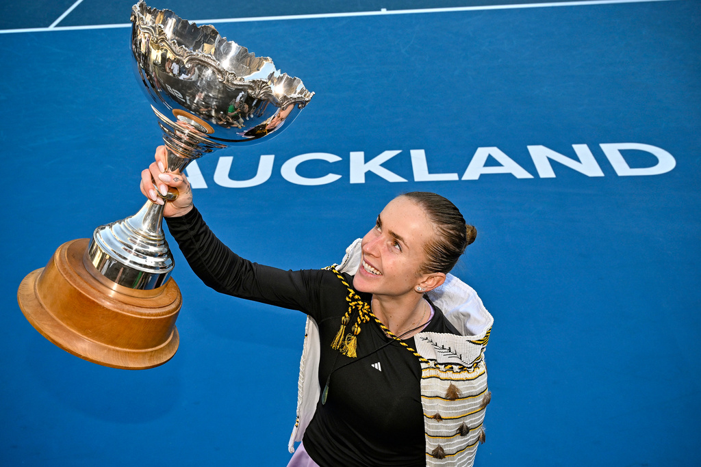 Elina Svitolina of Ukraine holds her trophy aloft after defeating Wang Xinju of China in the women's single final of the ASB Classic women's tennis tournament in Auckland, New Zealand on Sunday 11 Jan. 2026. (Alan Lee/Photosport via AP)
