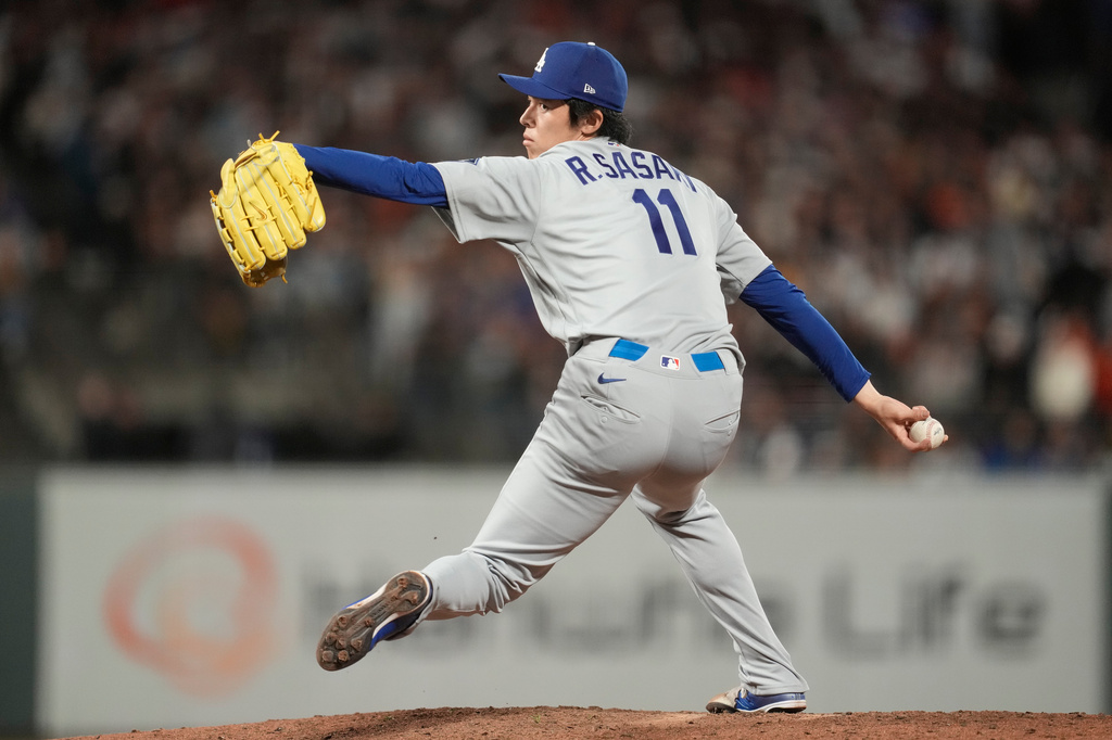 Los Angeles Dodgers pitcher Roki Sasaki throws against the San Francisco Giants during the eighth inning of a baseball game, Friday, Sept. 25, 2026, in San Francisco. (AP Photo/Jeff Chiu)
