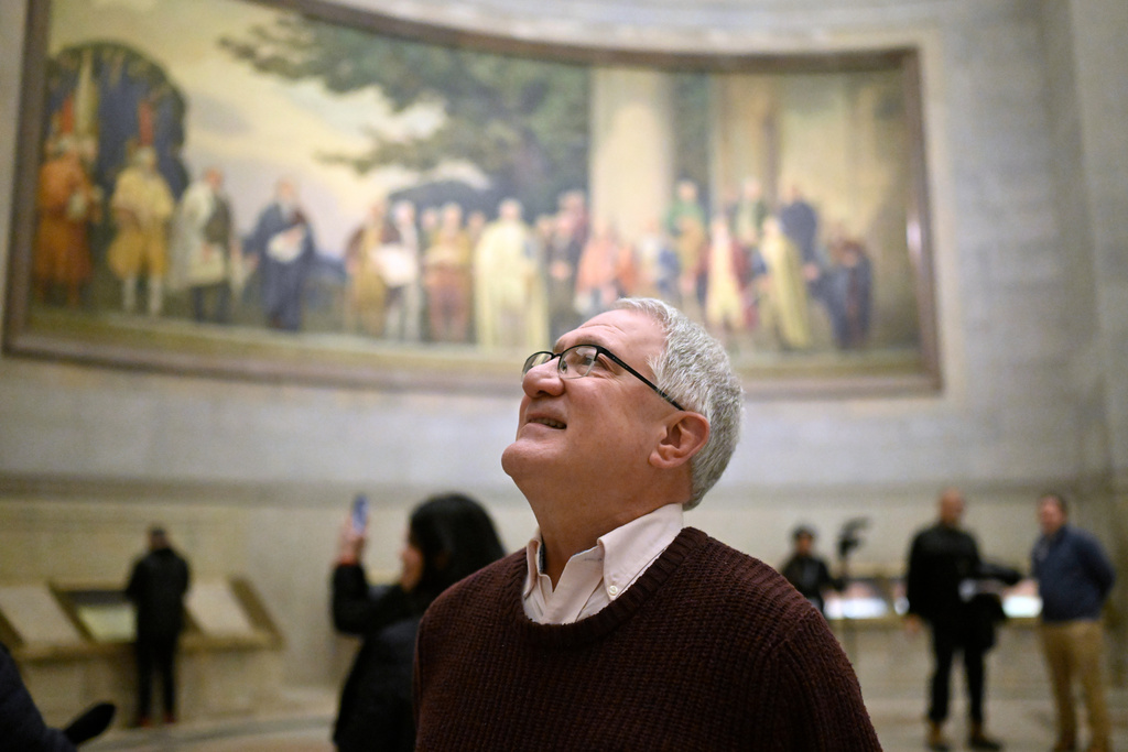 Kevin Sullivan of Milwaukee, looks at a wall mural at the National Archives Thursday, Jan. 29, 2026, in Washington. (AP Photo/John McDonnell)