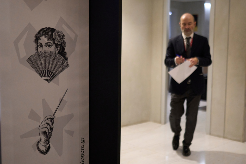 A Greek National Opera staff member is seen during the International Opera Awards in Athens, on Thursday, Nov. 13, 2025. (AP Photo/Petros Giannakouris)