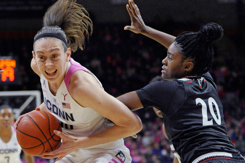 FILE - Connecticut's Breanna Stewart, left, drives to the basket as Cincinnati's Maya Benham, right, defends during the first half of an NCAA college basketball game Wednesday, Feb. 17, 2016, in Storrs, Conn. (AP Photo/Jessica Hill, File)