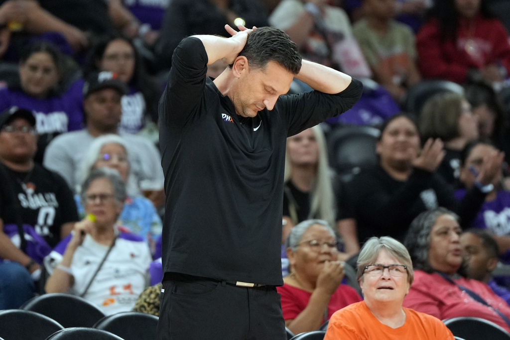 Phoenix Mercury head coach Nate Tibbetts reacts after a call against the Las Vegas Aces during the second half of Game 4 of the WNBA basketball finals, Friday, Oct. 10, 2025, in Phoenix. (AP Photo/Rick Scuteri)