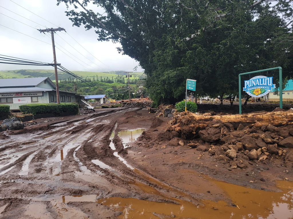 A roadway is washed out by mud on Monday, Aug. 17, 2026, in Naalehu, Hawaii, following heavy rains from Hurricane Lala. (Aina Akamu via AP)