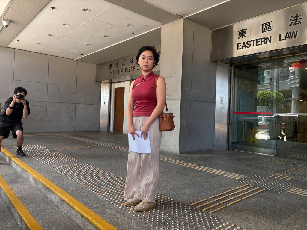 Selina Cheng, chair of the Hong Kong Journalists Association and a former reporter for The Wall Street Journal, is photographed before speaking to reporters at the Eastern Magistrates' Courts following a verdict on Thursday, Sept. 10, 2026. (AP Photo/Kanis Leung)