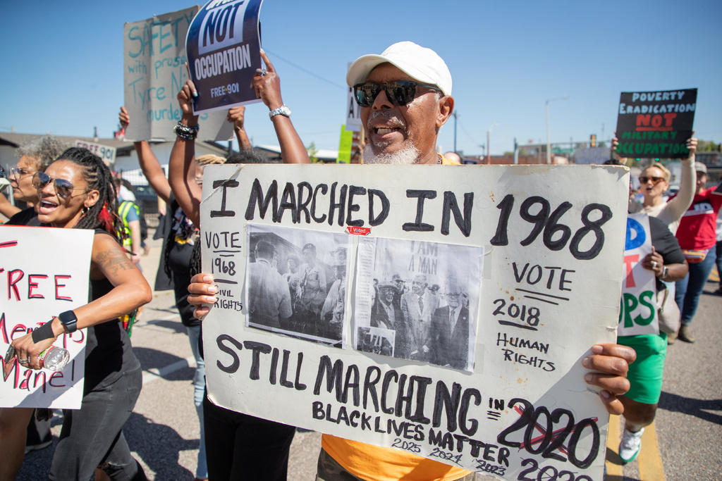Joe Calhoun, who marched with the Memphis Sanitation Strike as an 18-year-old, joins community activists in Memphis, Tenn., Saturday, Sept. 27, 2025, joins in a march against the deployment of National Guard troops to Memphis. (AP Photo/Nikki Boertman)