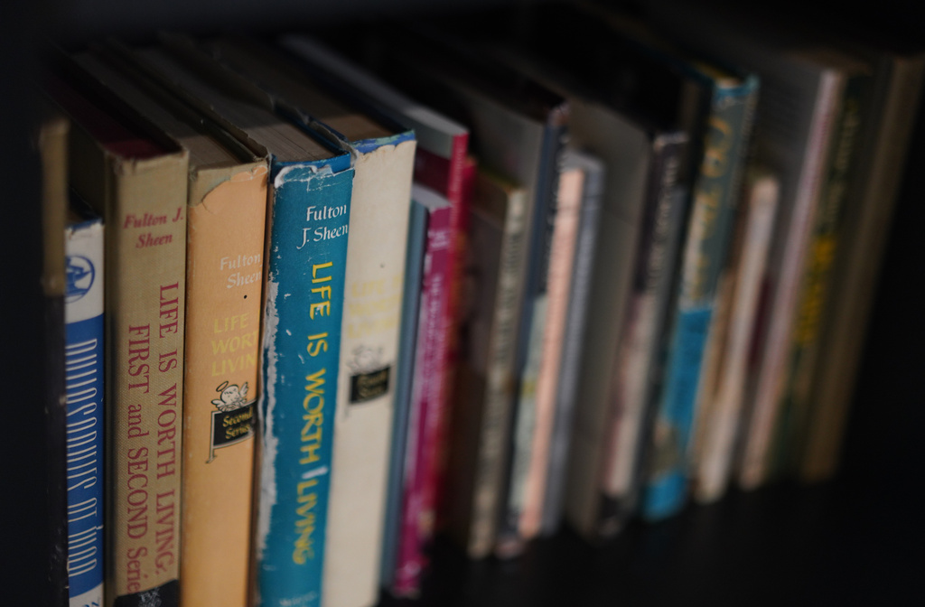 Books written by the late Archbishop Fulton Sheen at the Sheen Museum in Peoria, Ill., on July 15, 2026. (AP Photo/Jessie Wardarski)