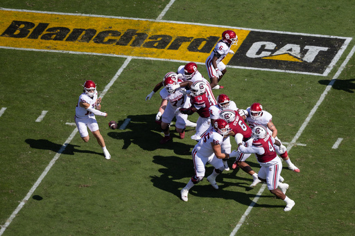 A Blanchard Cat logo is displayed on the field as Oklahoma quarterback John Mateer (10) throws against South Carolina during an NCAA college football game, Saturday, Oct. 18, 2025, in Columbia, S.C. (AP Photo/Scott Kinser) A Blanchard Cat logo is displayed on the field as Oklahoma quarterback John Mateer (10) throws against South Carolina during an NCAA college football game, Saturday, Oct. 18, 2025, in Columbia, S.C. (AP Photo/Scott Kinser)