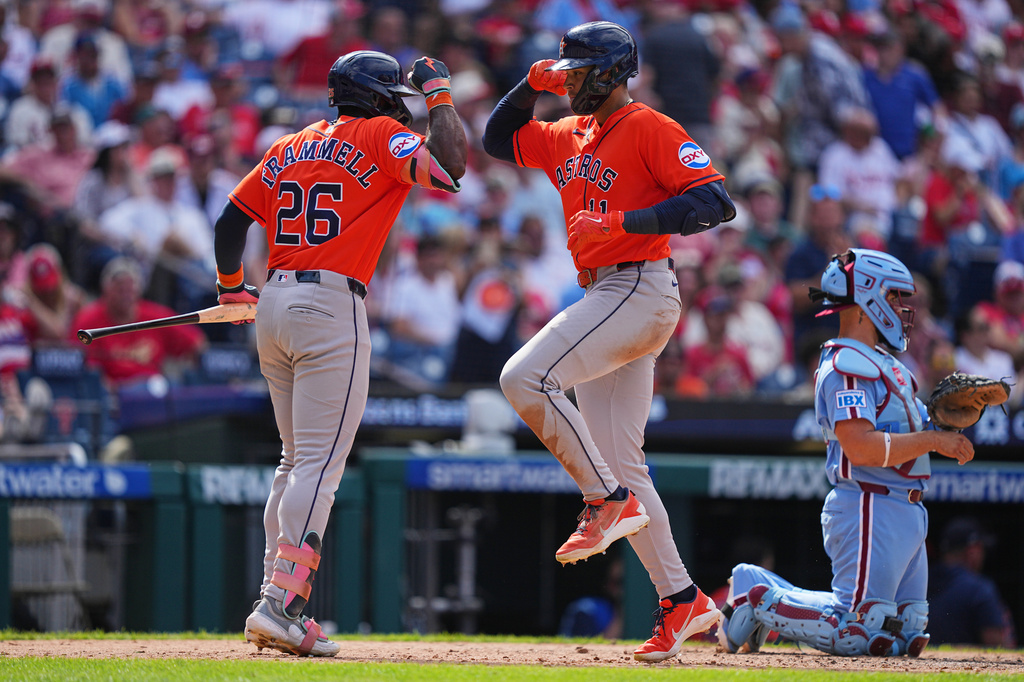 Houston Astros' Cam Smith, center, celebrates with teammate Taylor Trammell, after hitting a home run off of Philadelphia Phillies pitcher Jhoan Duran during the ninth inning of a baseball game, Thursday, Sept. 10, 2026, in Philadelphia. (AP Photo/Matt Rourke)
